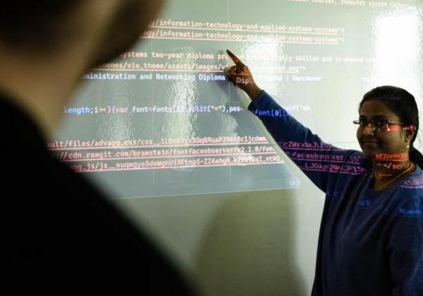 Young female student at a blackboard