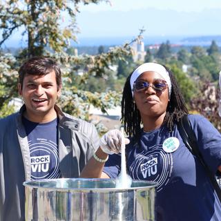two students serve cotton candy