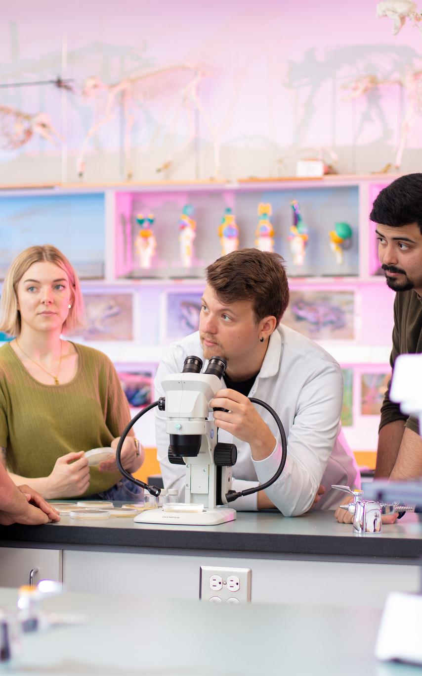 VIU students and professor working in a lab.