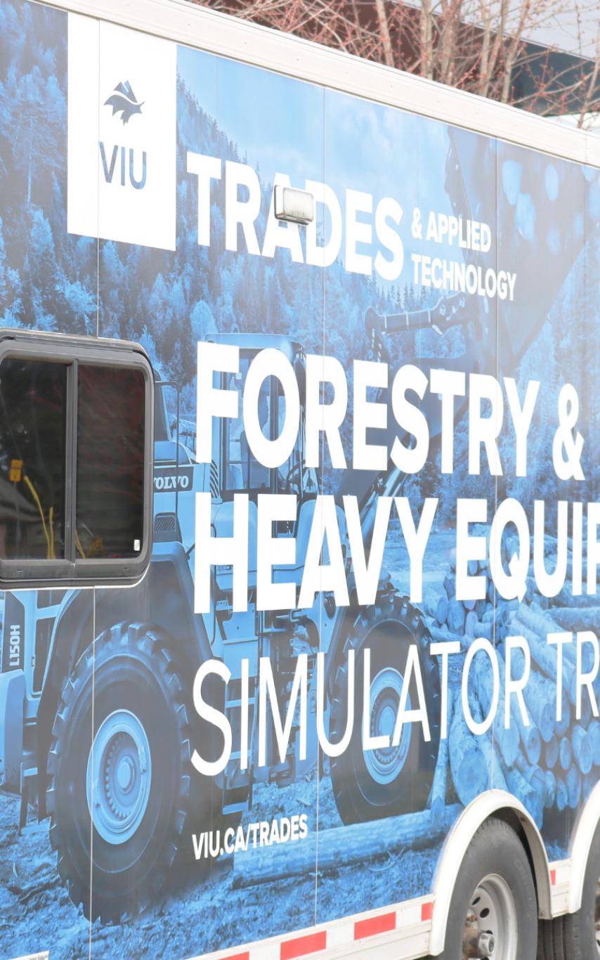 Semi truck with a simulator set up inside.